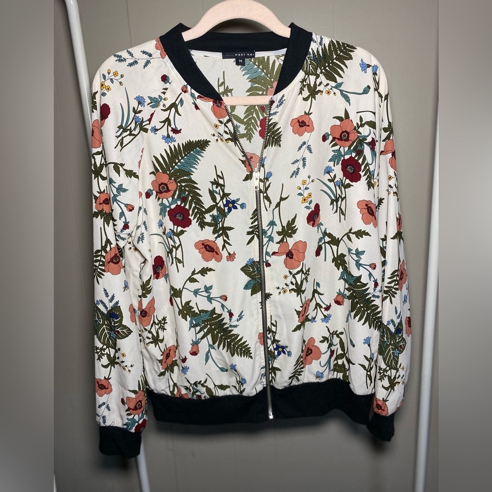 Floral print light zip up jacket.